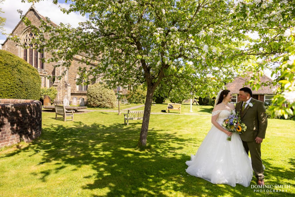Bride and Groom beneath the blossom