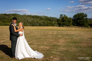 Bride and Groom portrait in a field