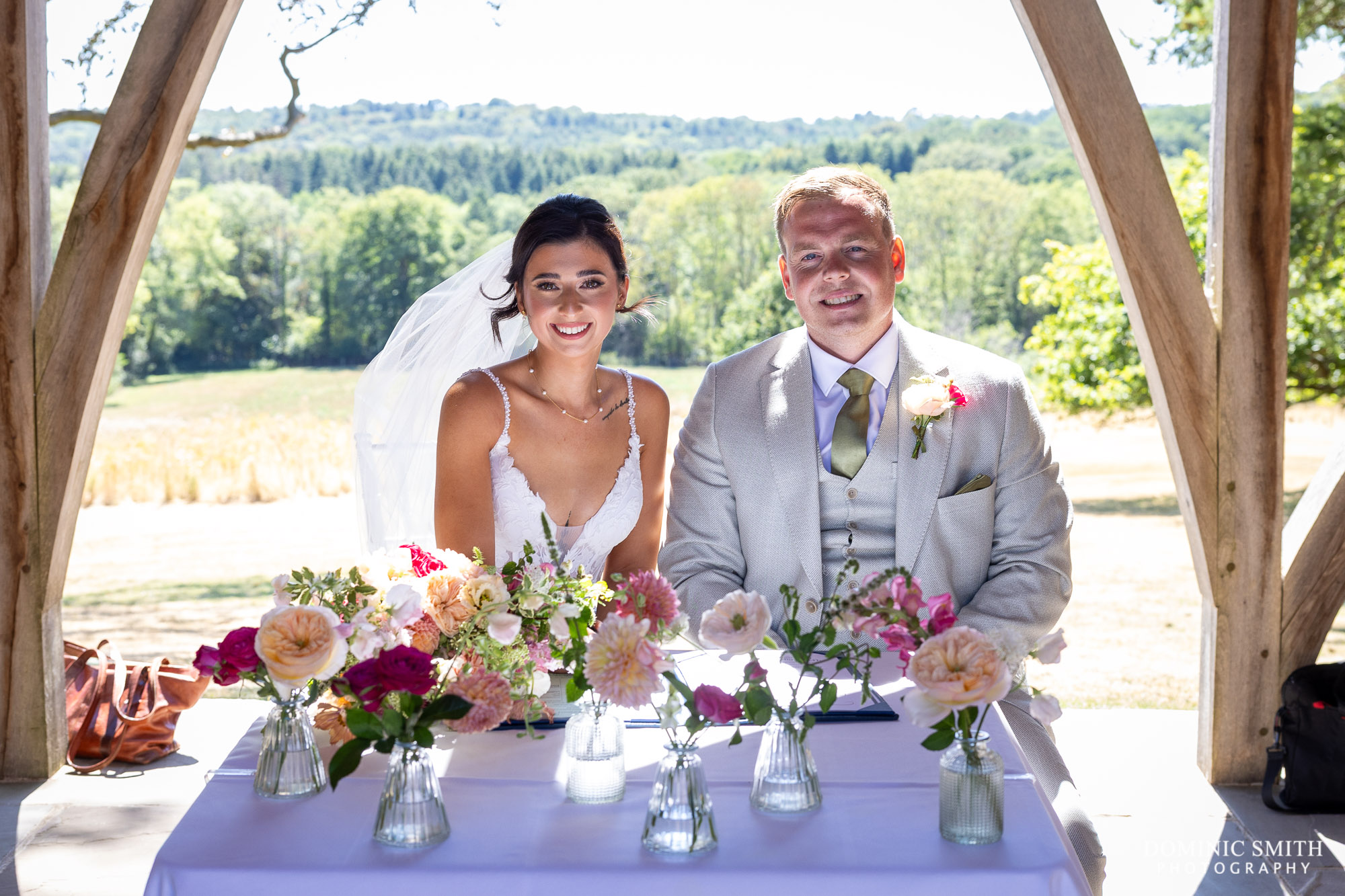 Bride and Groom signing the register at Highley Manor