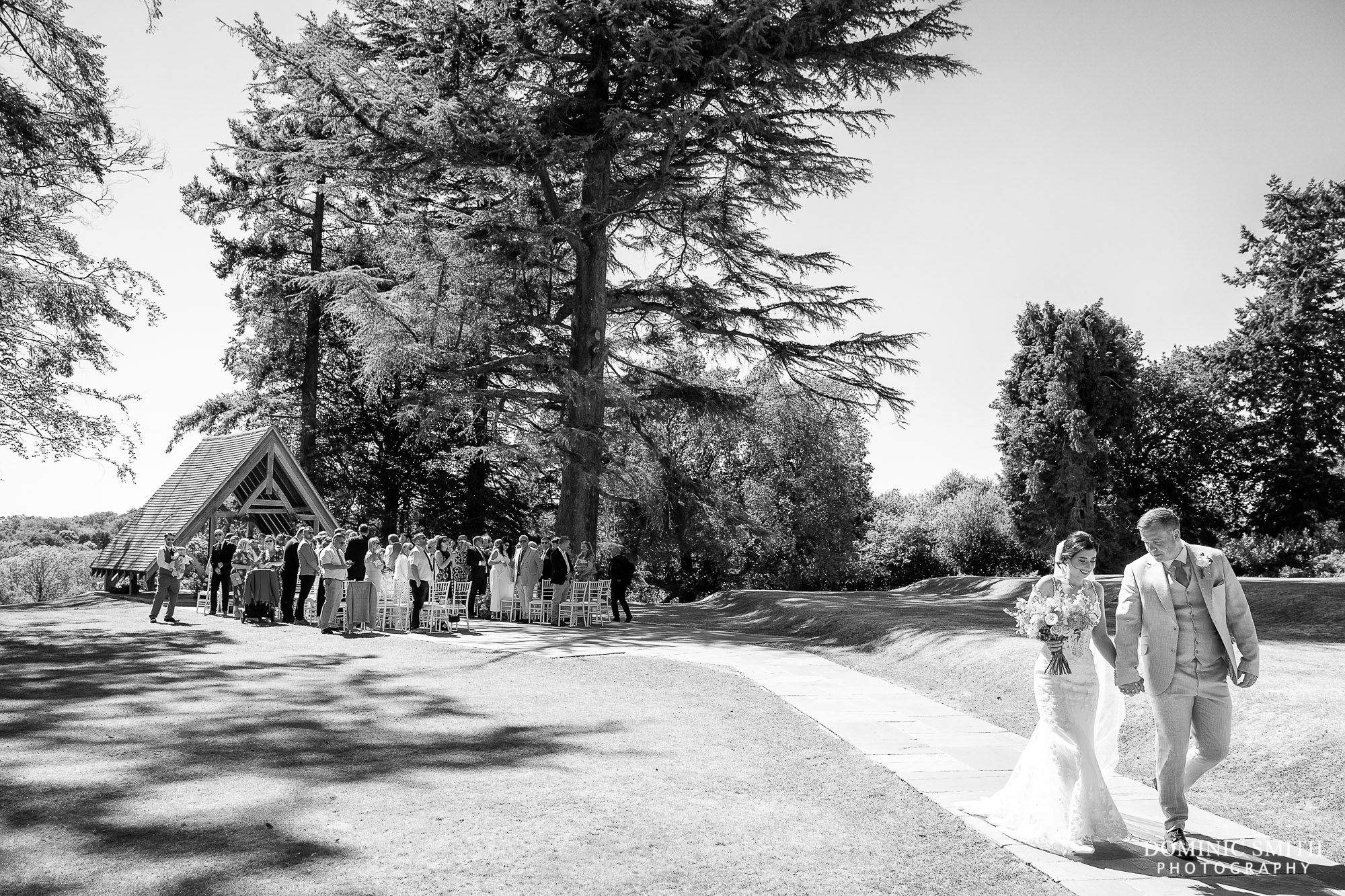 Bride and Groom walking away from their ceremony