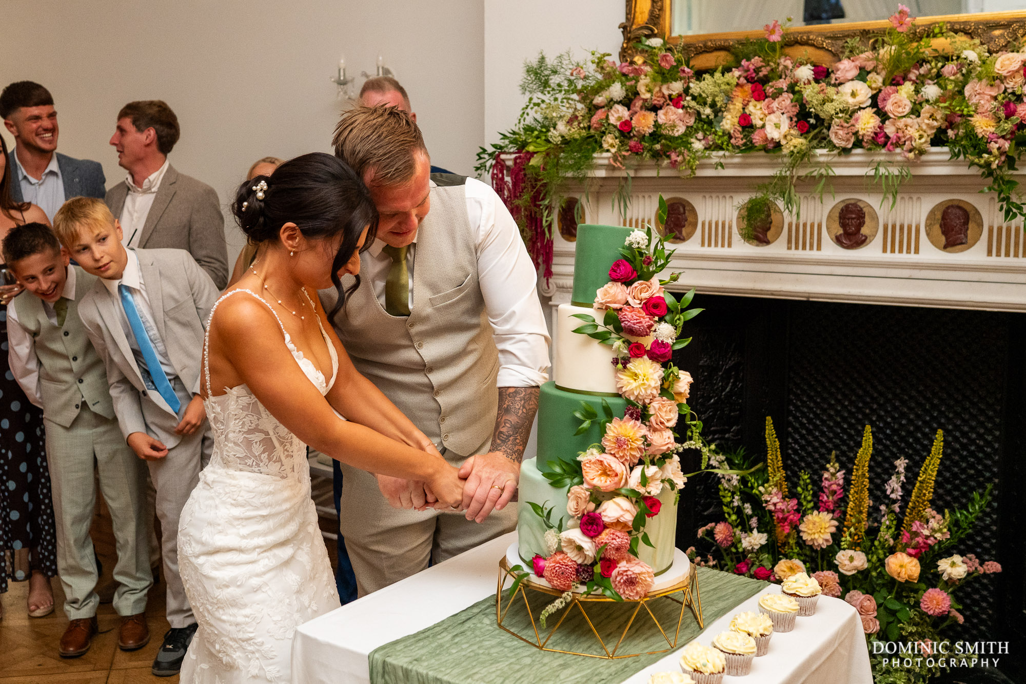 Bride and Groom cutting the cake at Highley Manor