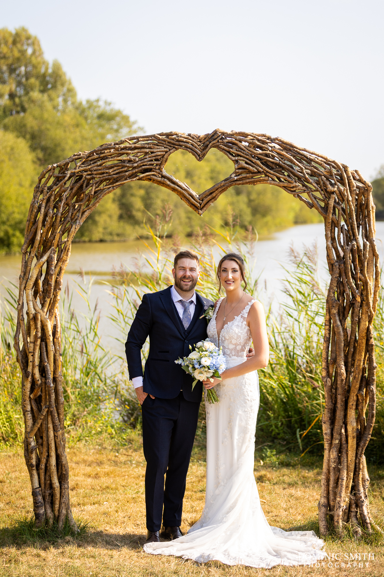 Bride and Groom pose at the Millwards Arch