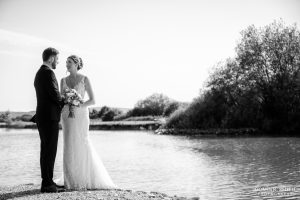 Bride and Groom by the lake at Millwards