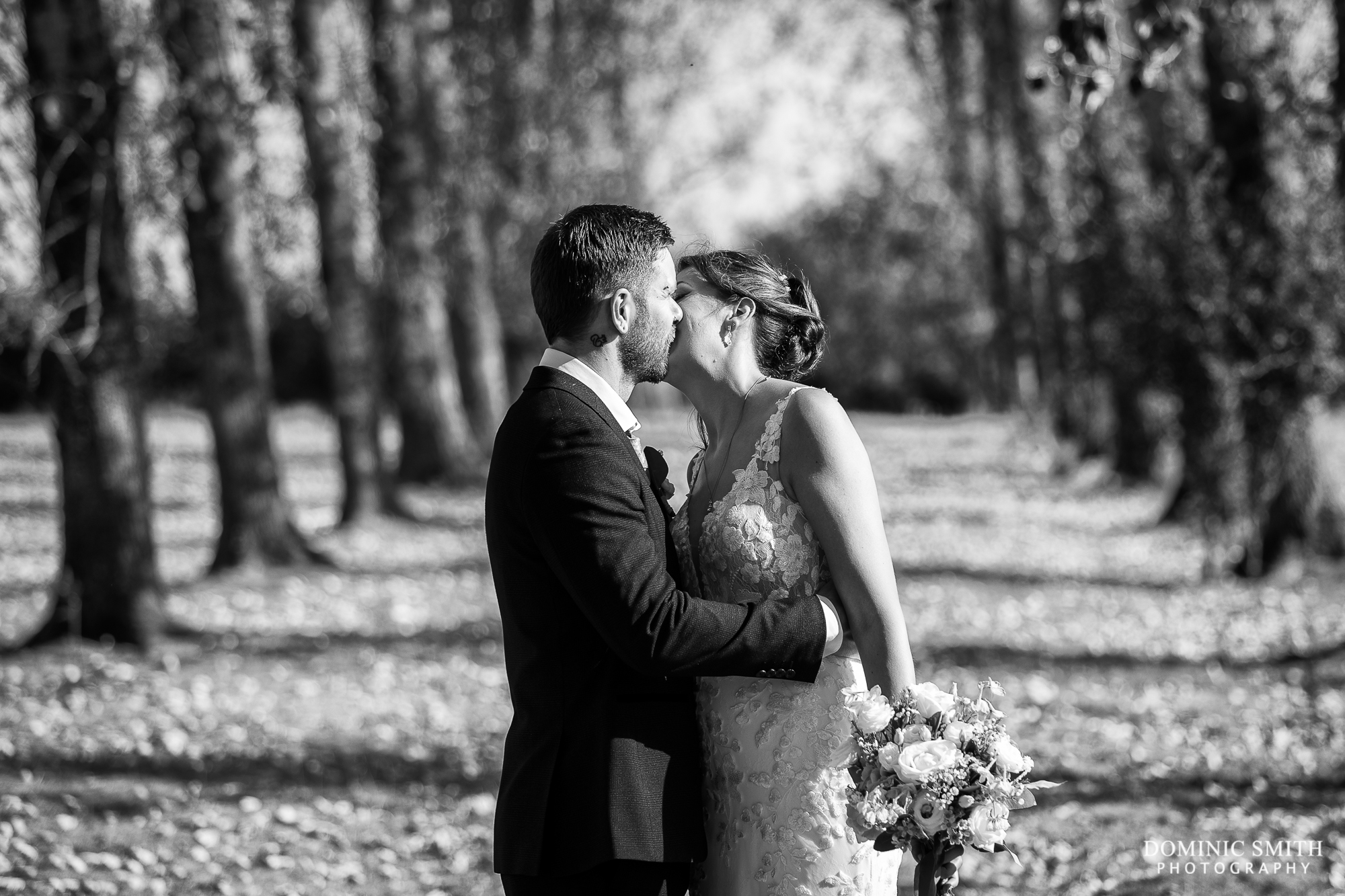 Bride and Groom share a kiss at Millwards Estate