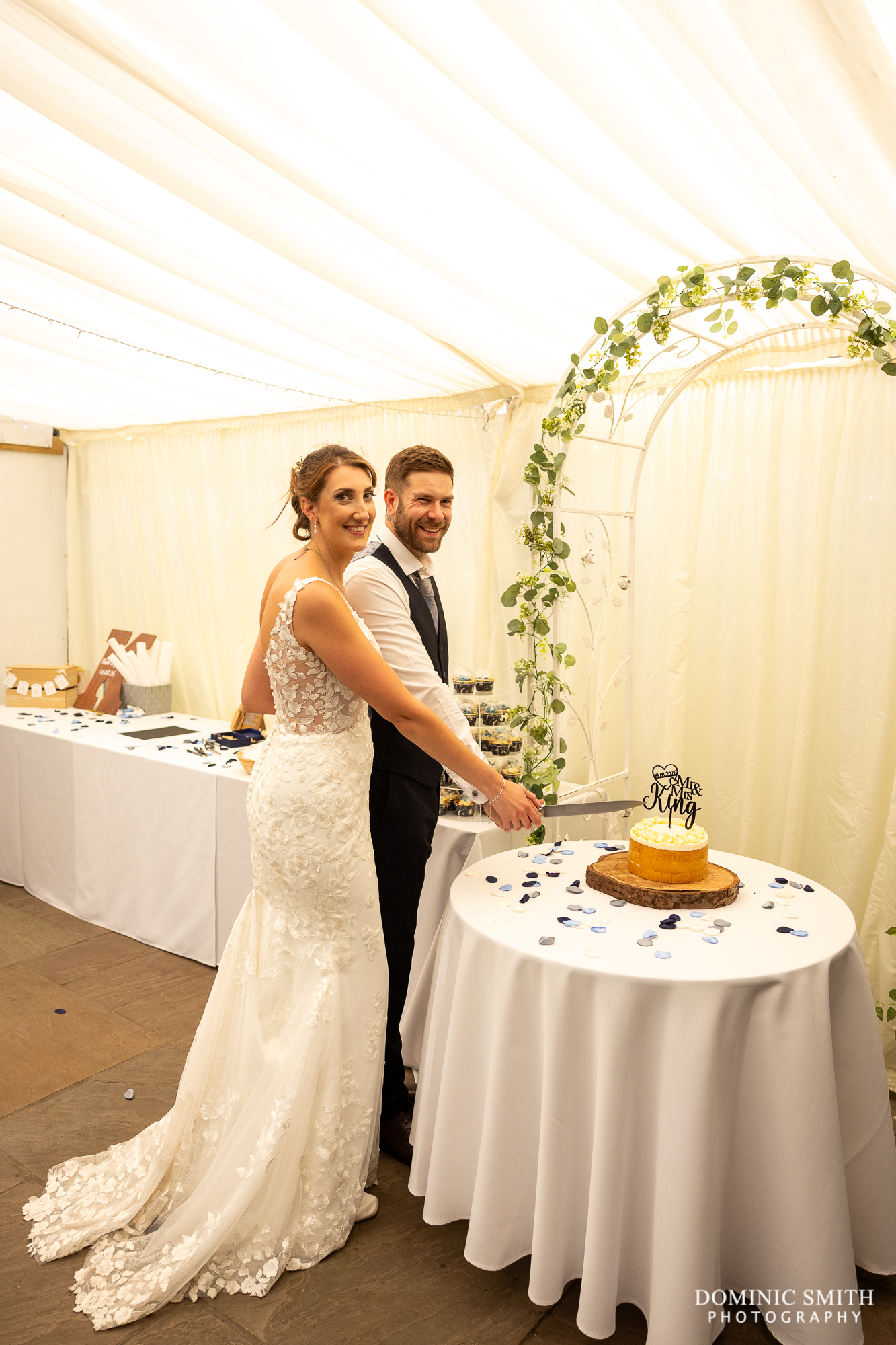 Cutting the wedding cake at Millwards Estate